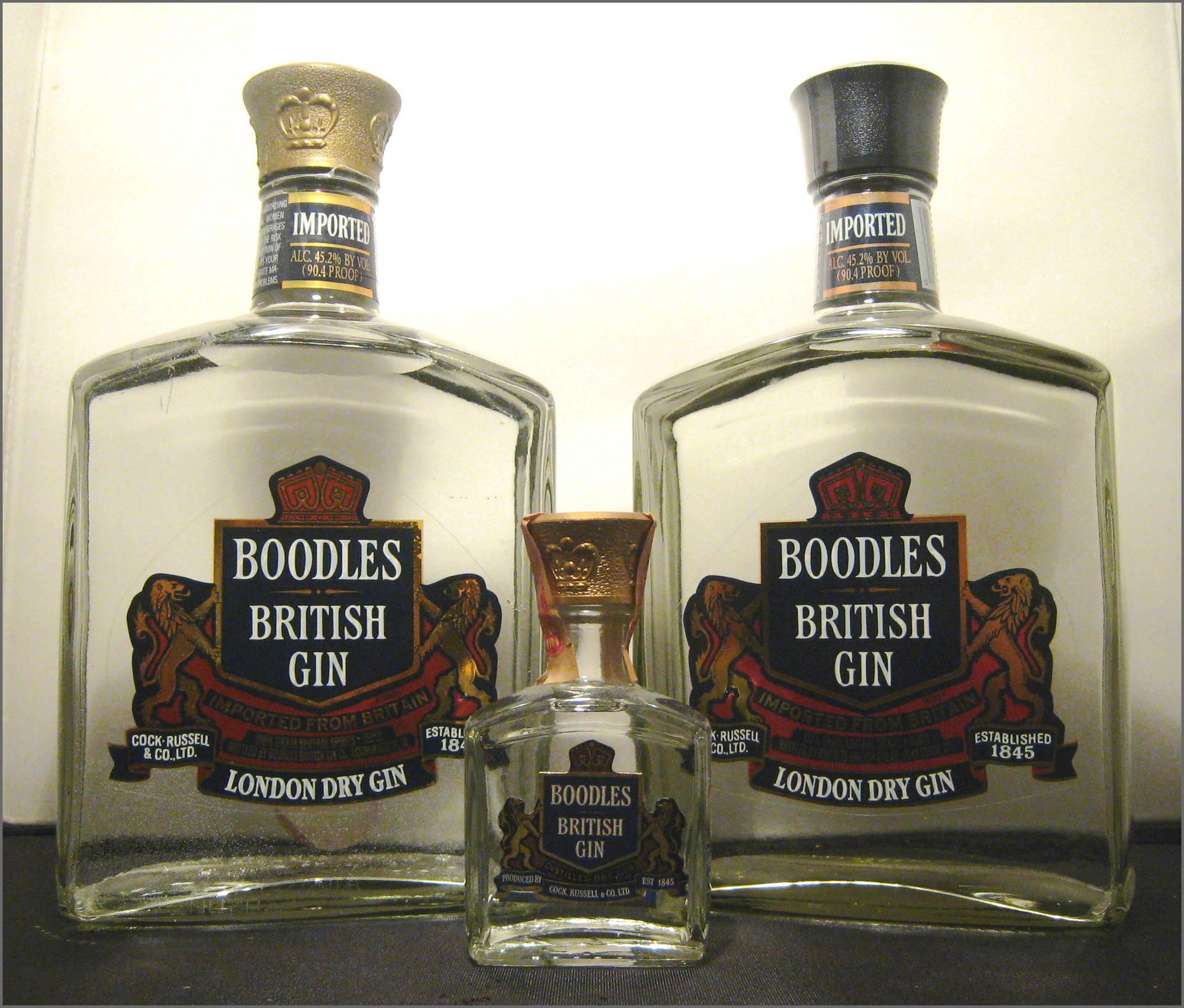 Classic Full-size With Miniature Boodles Gin Bottles Background