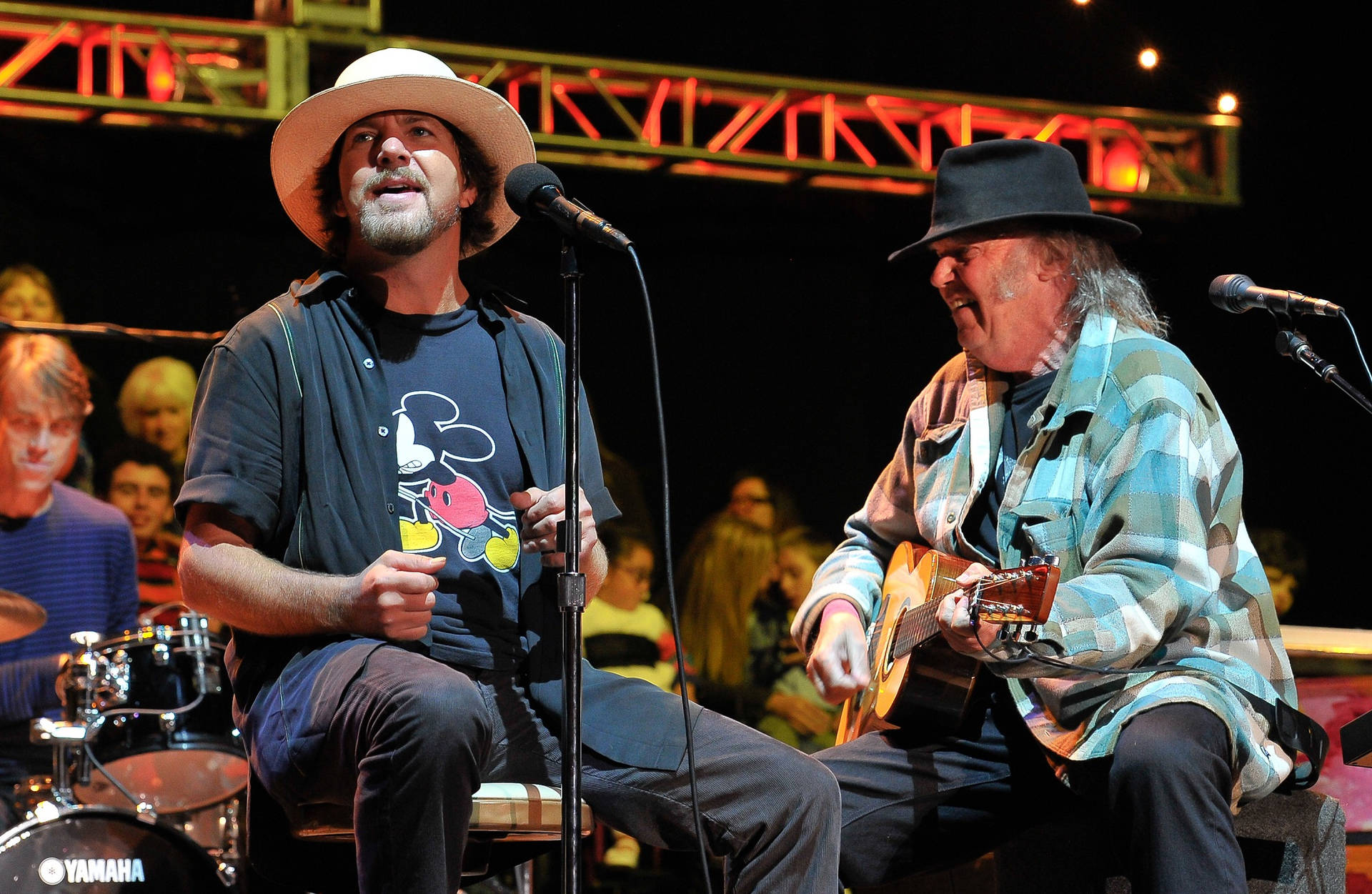 Classic Rock Icons - Eddie Vedder And Neil Young Performing With Pearl Jam Background