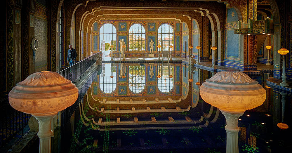 Classic Sculptures In Hearst Castle's Roman Pool Background