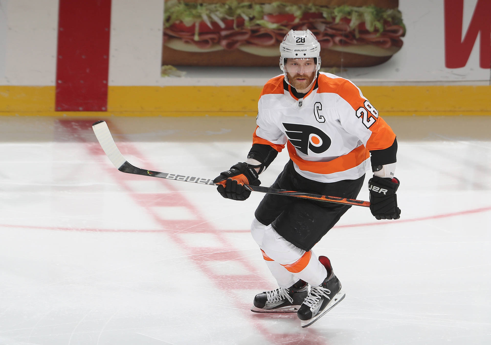 Claude Giroux In Action During An Nhl Game Background