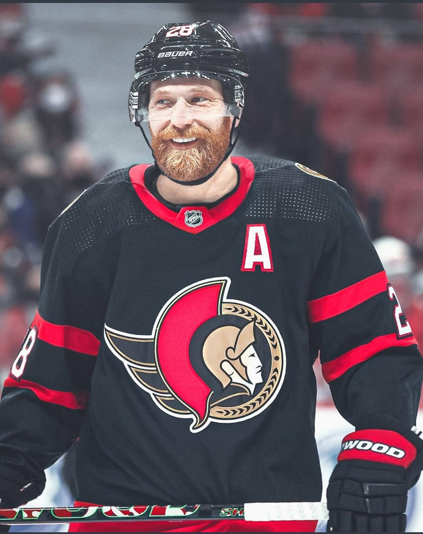 Claude Giroux Smiling At An Ottawa Senators Game Background