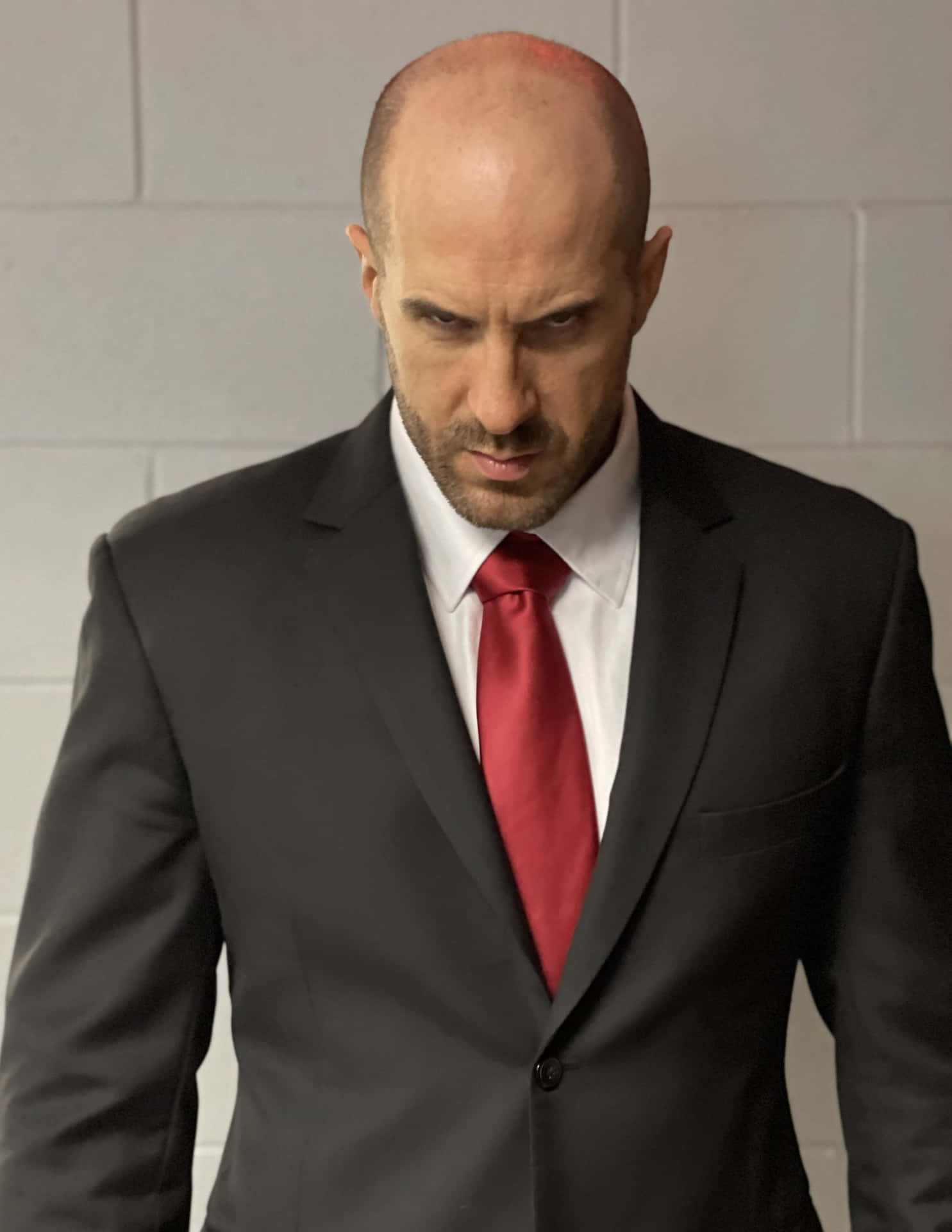 Claudio Castagnoli In Exclusive Black Suit Background