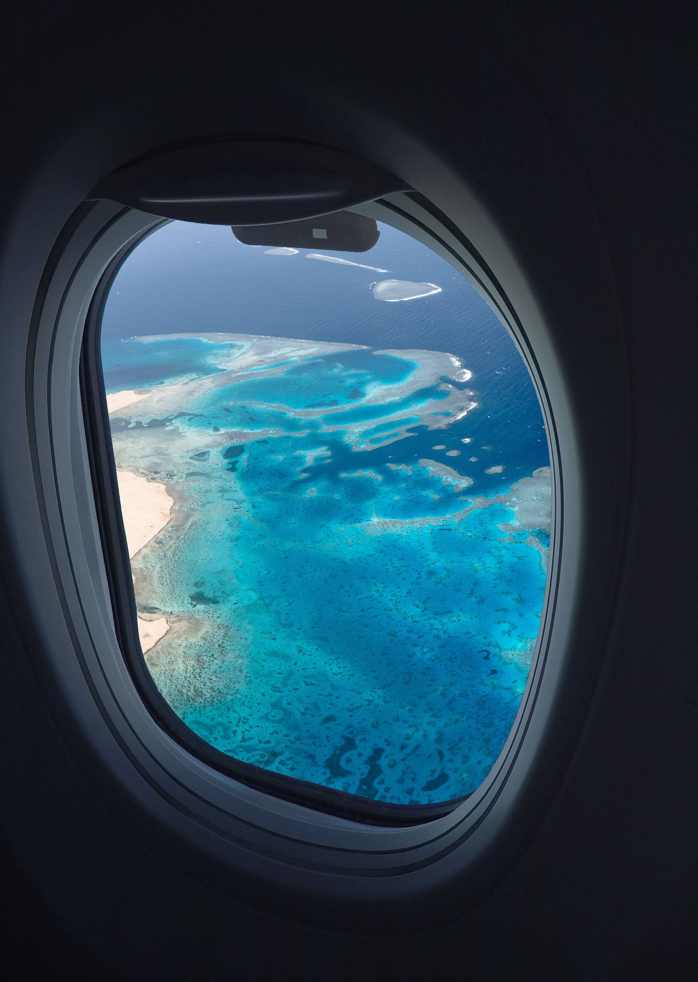 Clear Ocean Shot From A Plane Window Background