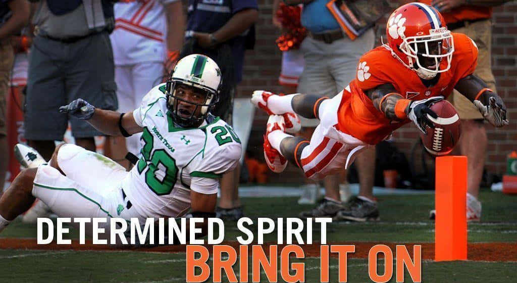 Clemson Tigers Football Player Diving For A Touchdown Background