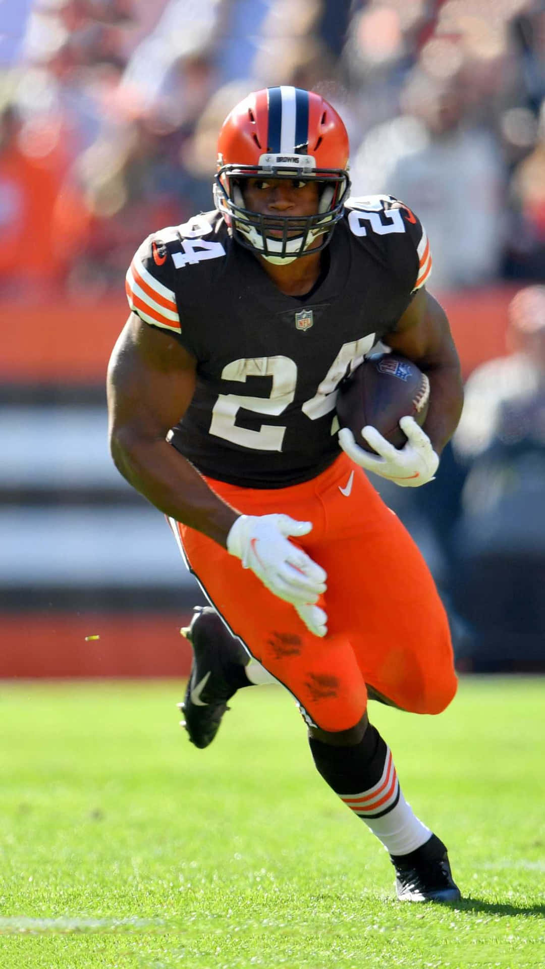 Cleveland Browns Player Running With Football Background