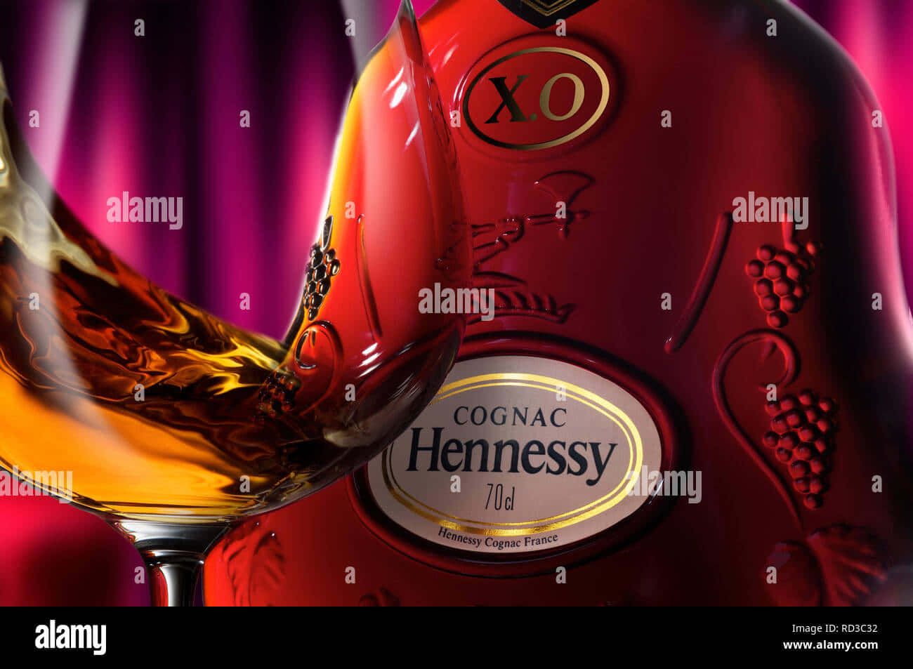 Clink Your Glass And Lift Your Spirits With Hennessy Background