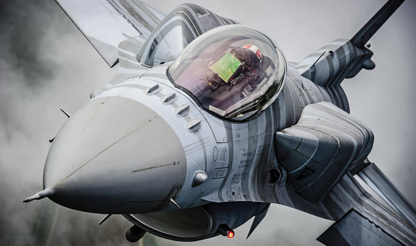 Close-up Capture Of A Fighter Jet Background