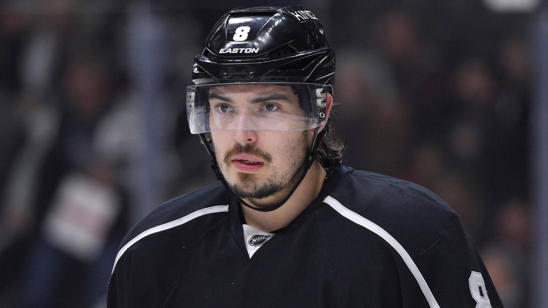 Close Up Look Of Drew Doughty Biting Lip While Focusing On Game Background