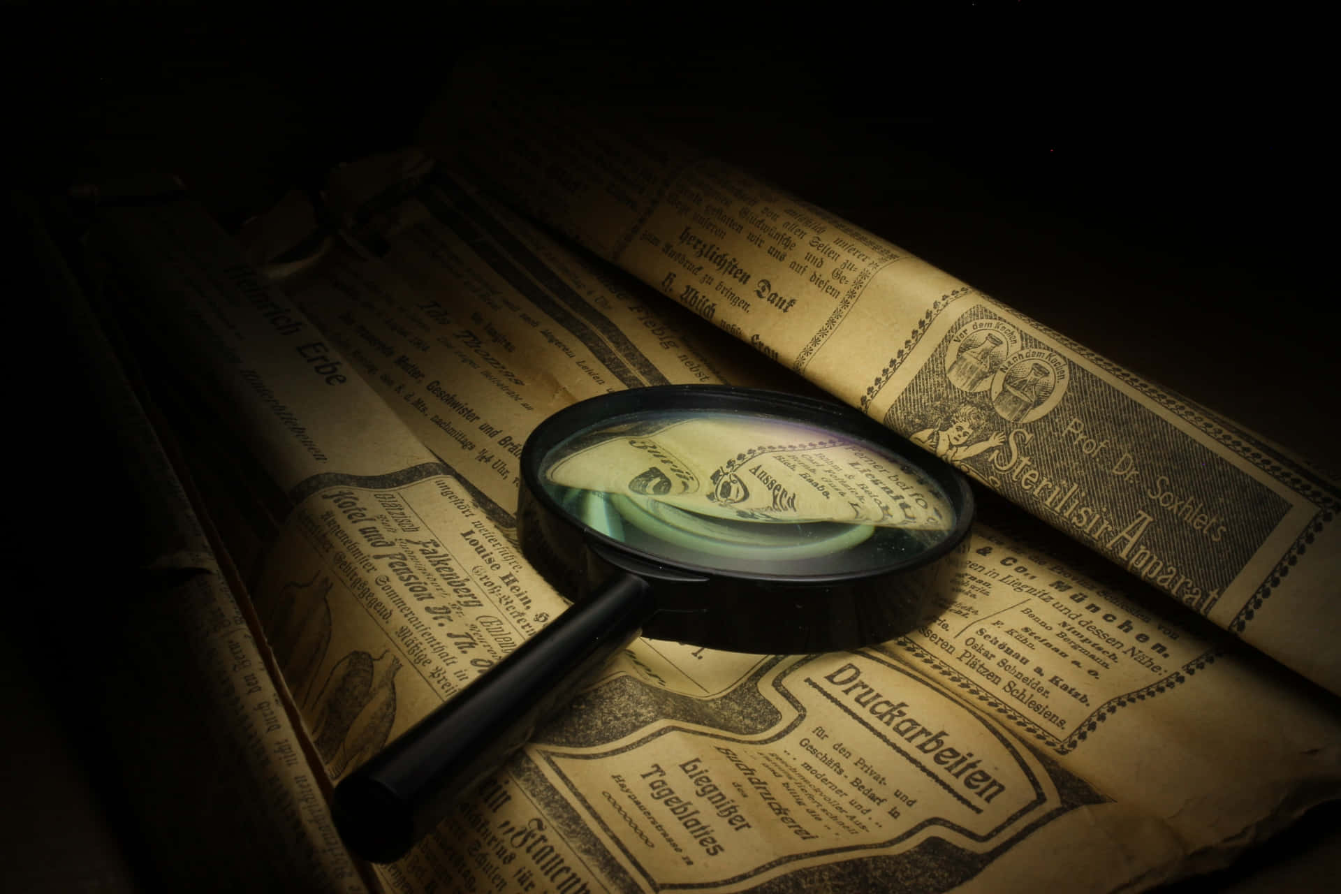 Close-up Of A Magnifying Glass On A Newspaper Article