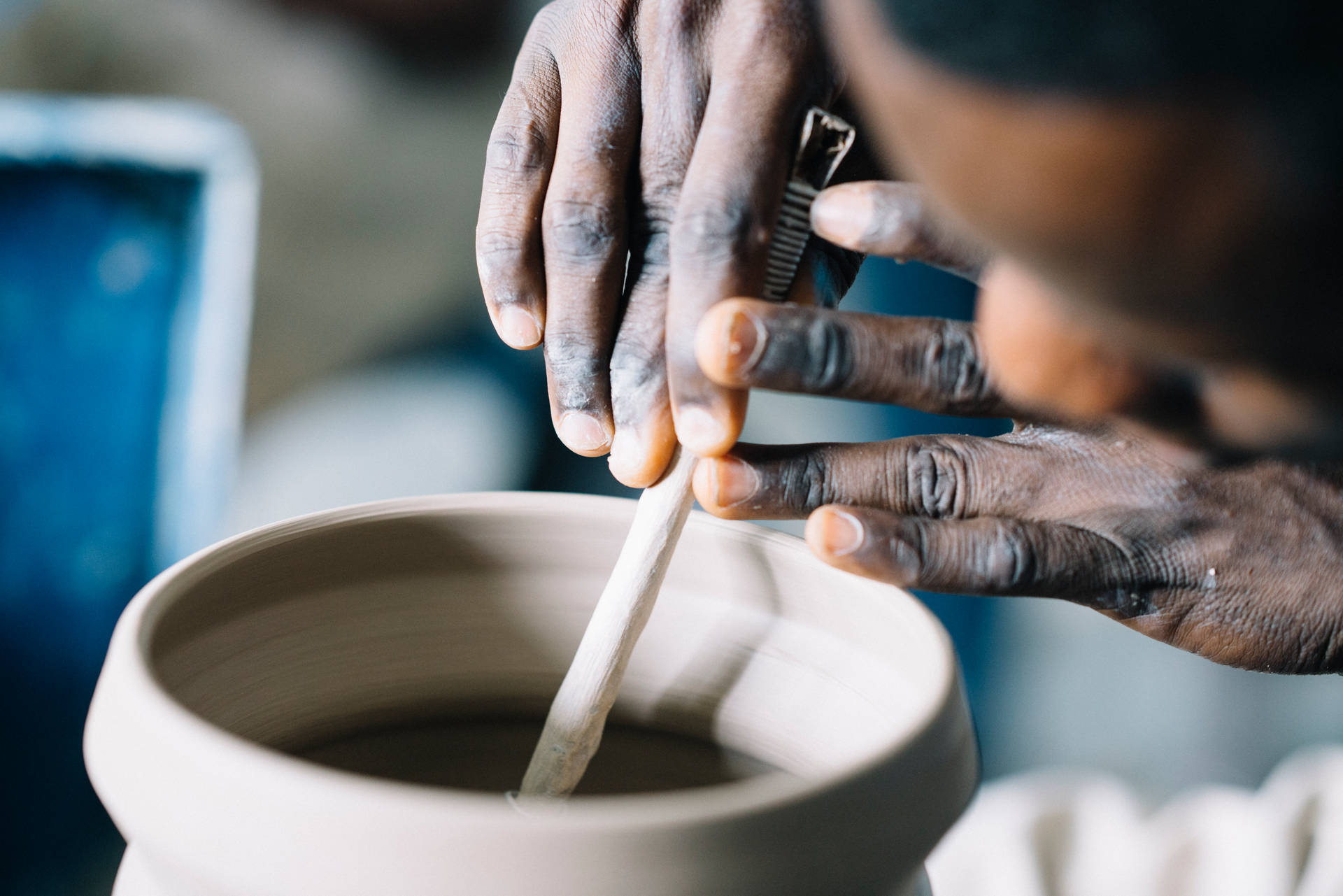 Close-up Of Hands Doing Pottery In Sierra Leone Background