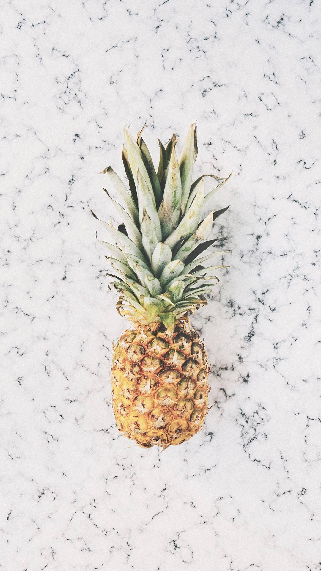 Close-up Of Pineapple Against A Marble Background Background