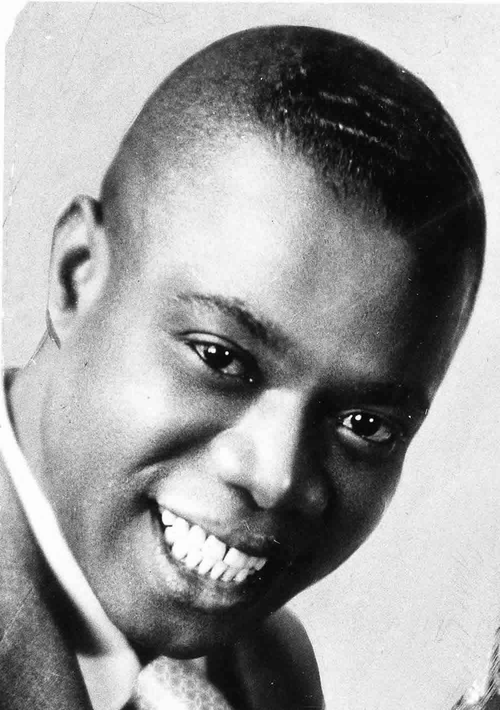 Close-up Photo Louis Armstrong Background