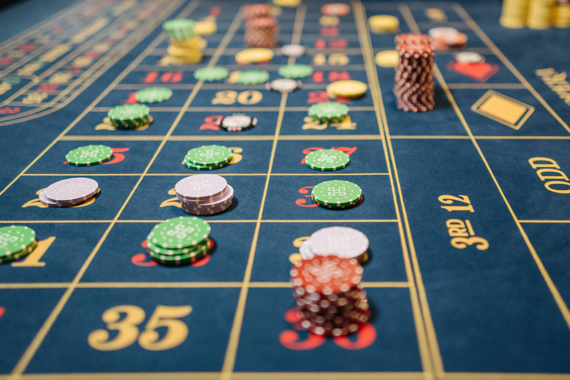 Close-up Photo Of Chip Bets On Blue Table Baccarat Background