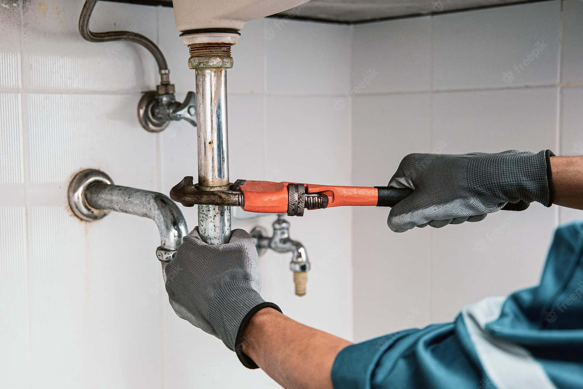 Close Up Plumber Fixing Plumbing System