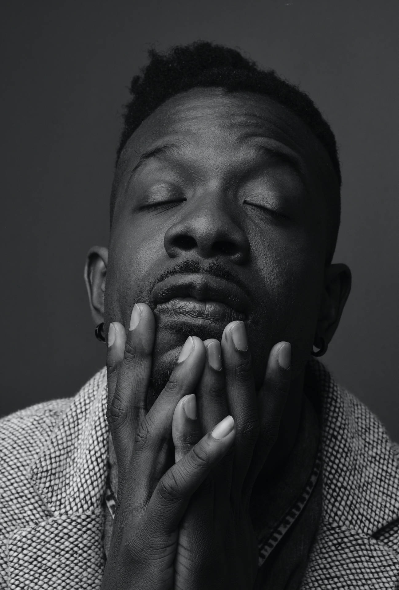 Close-up Portrait Of A Resilient Black Man Background