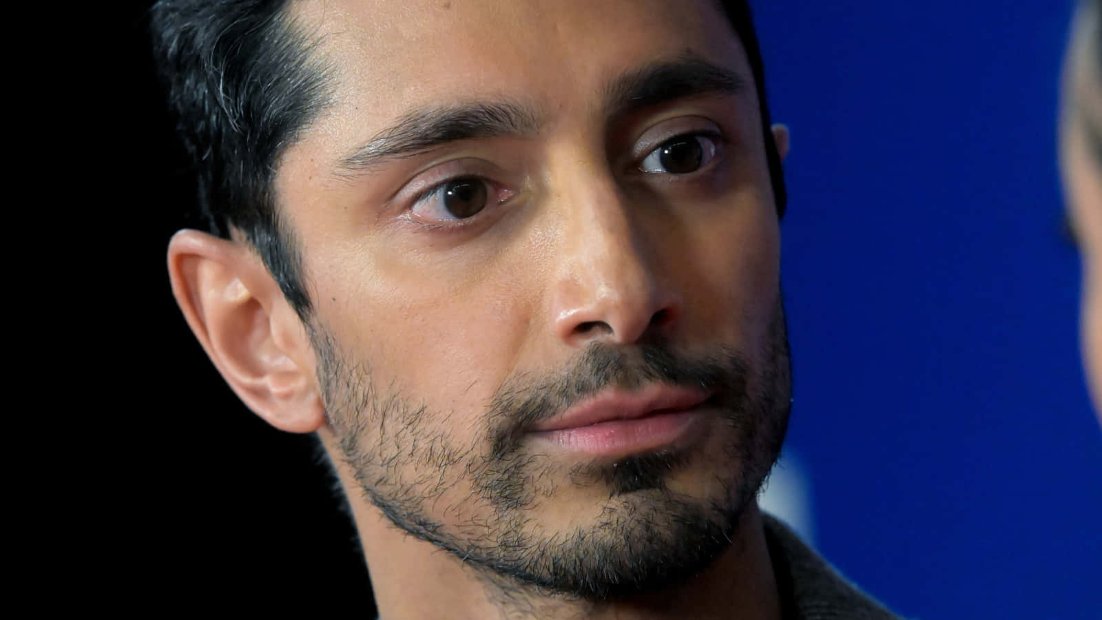 Close Up Portraitof Man Against Blue Background