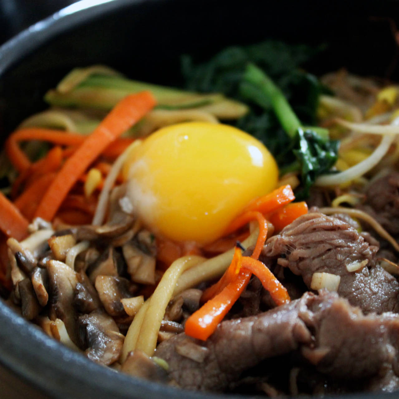 Close-up Shot Of Bibimbap With Raw Egg