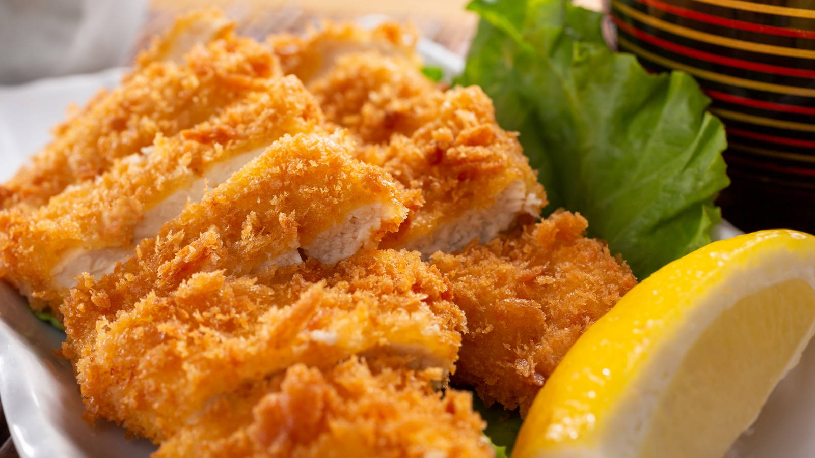 Close-up Tonkatsu With Slice Of Lemon Background