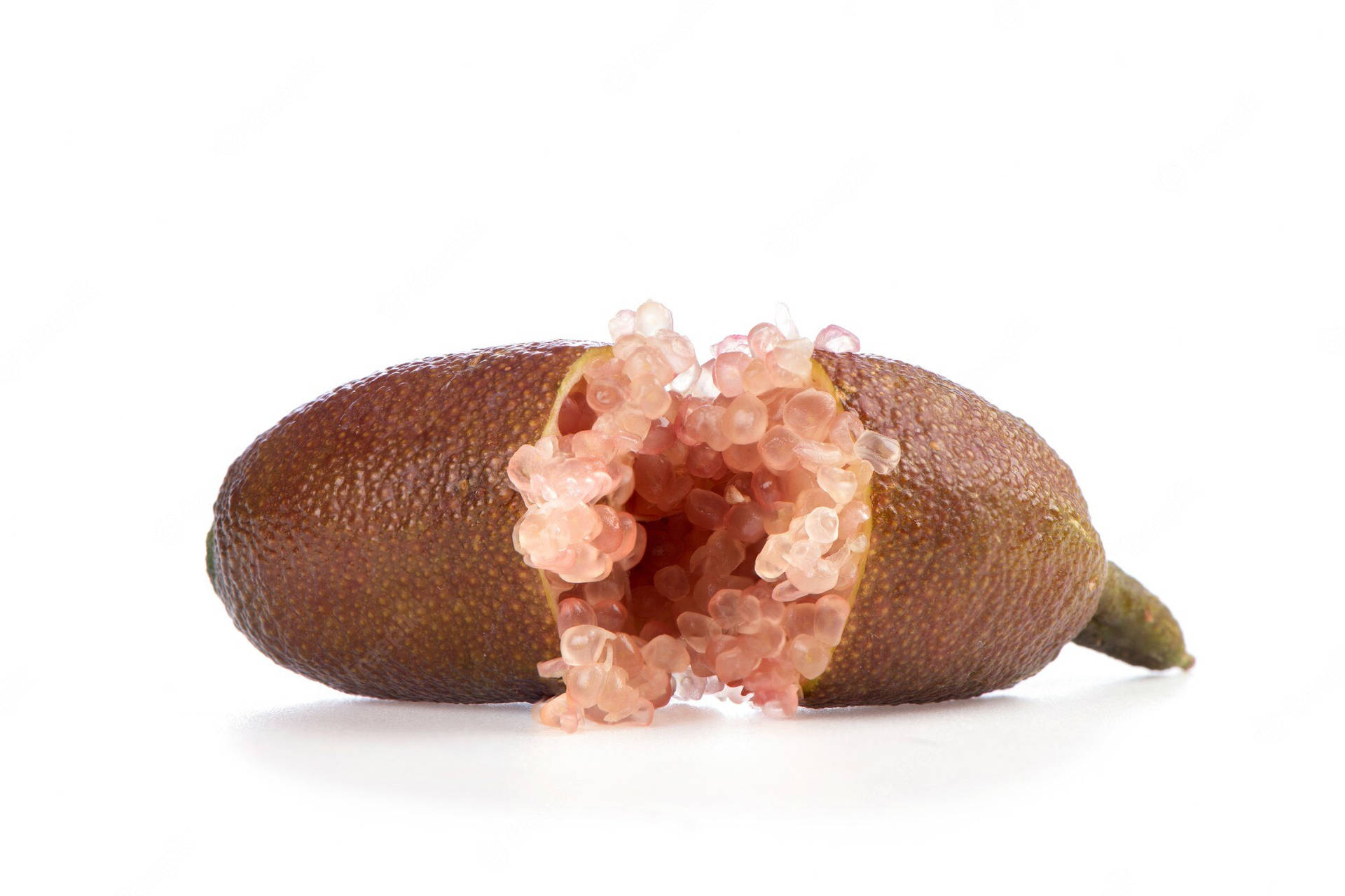 Close-up View Of Halved Pink Finger Lime Background