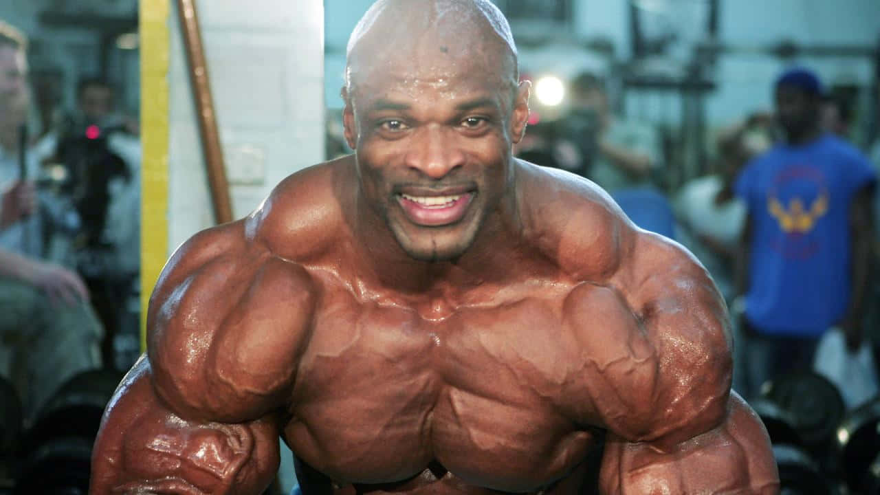 Closer Look Of Ronnie Coleman In A Pose Background