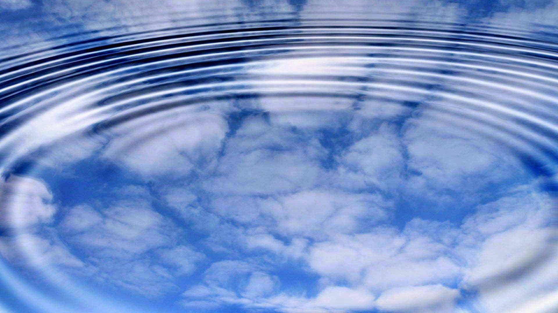 Cloud Reflection On Rippling Water Background