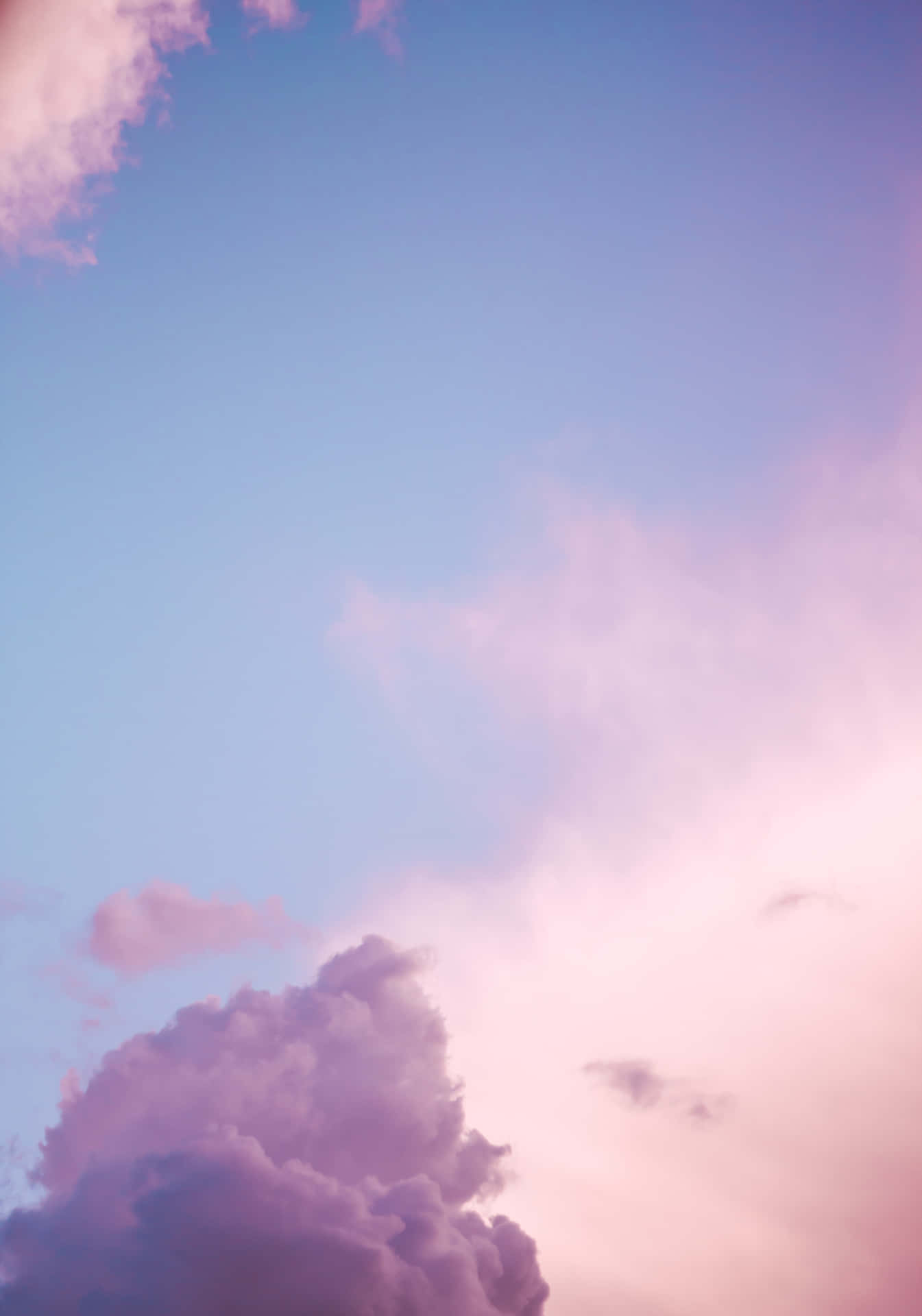 Clouds Of Pink And Blue Take Over The Sky Background