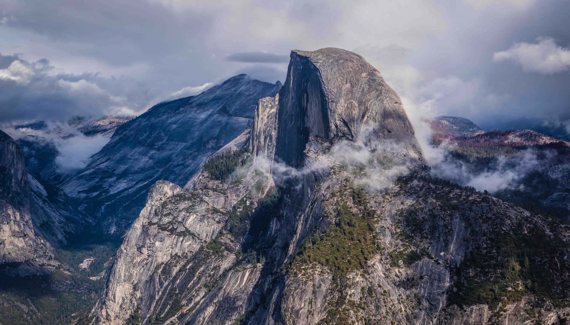 Clouds Passing Through A Mountain Background