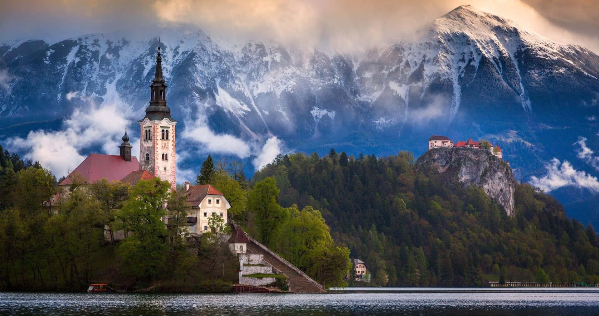 Clouds Reaching The Julian Alps Behind Lake Bled