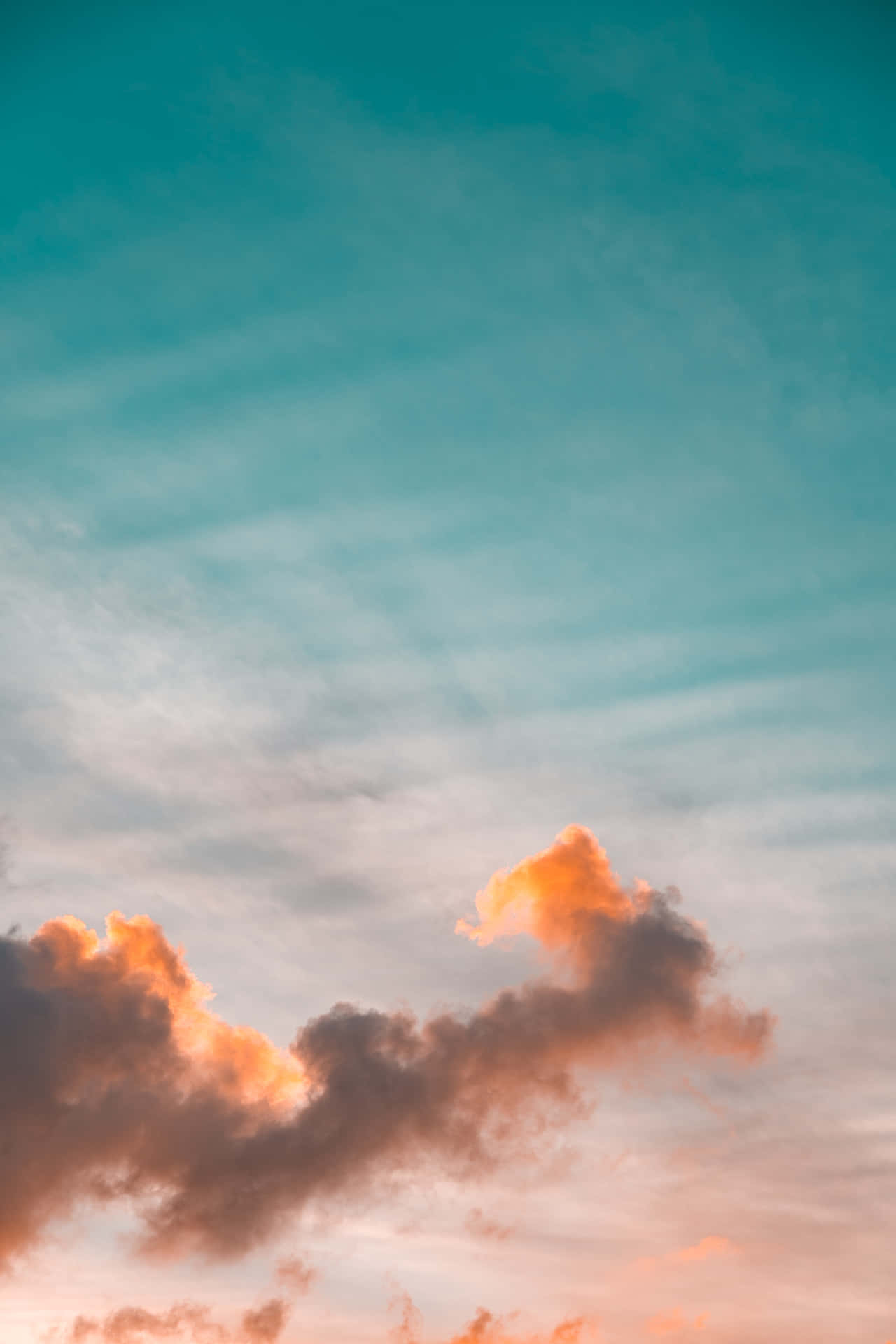 Cloudy Orange And Teal Sky Background