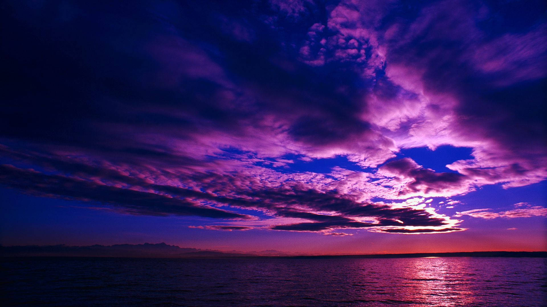 Cloudy Purple Night Sky Near Sunset Background