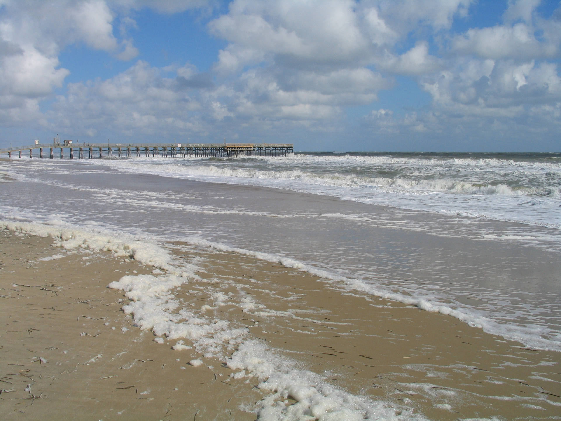 Cloudy Sky Above Virginia Beach Shoreline Background