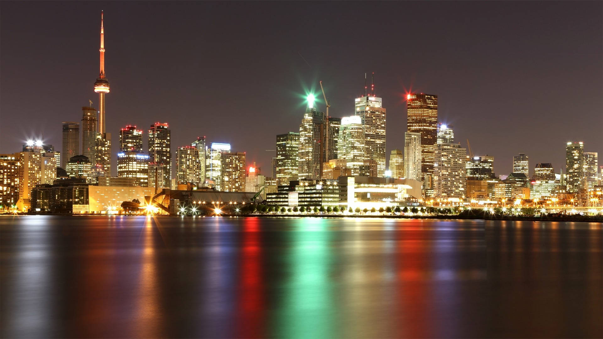 Cn Tower And Bright City Lights Background