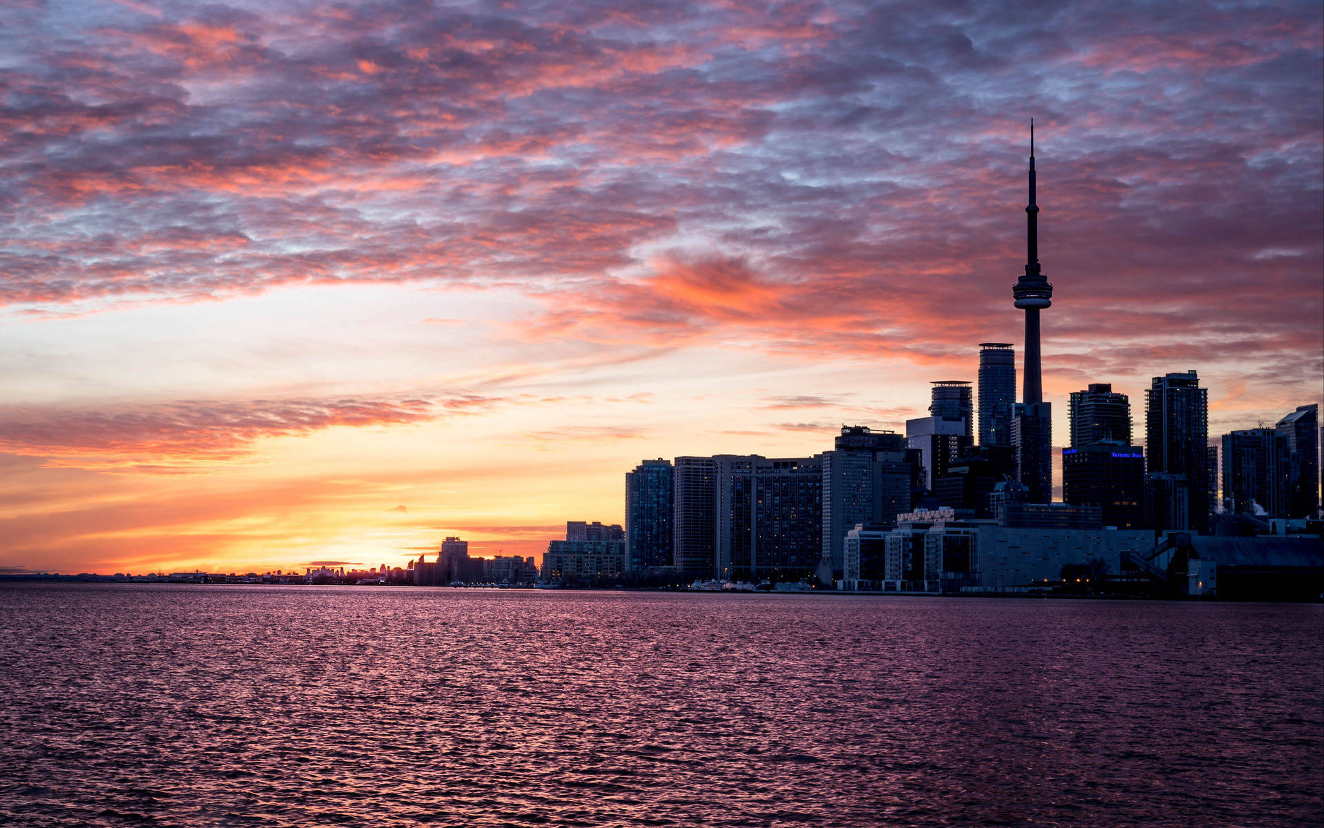 Cn Tower Silhouette With Stunning Sunset Background