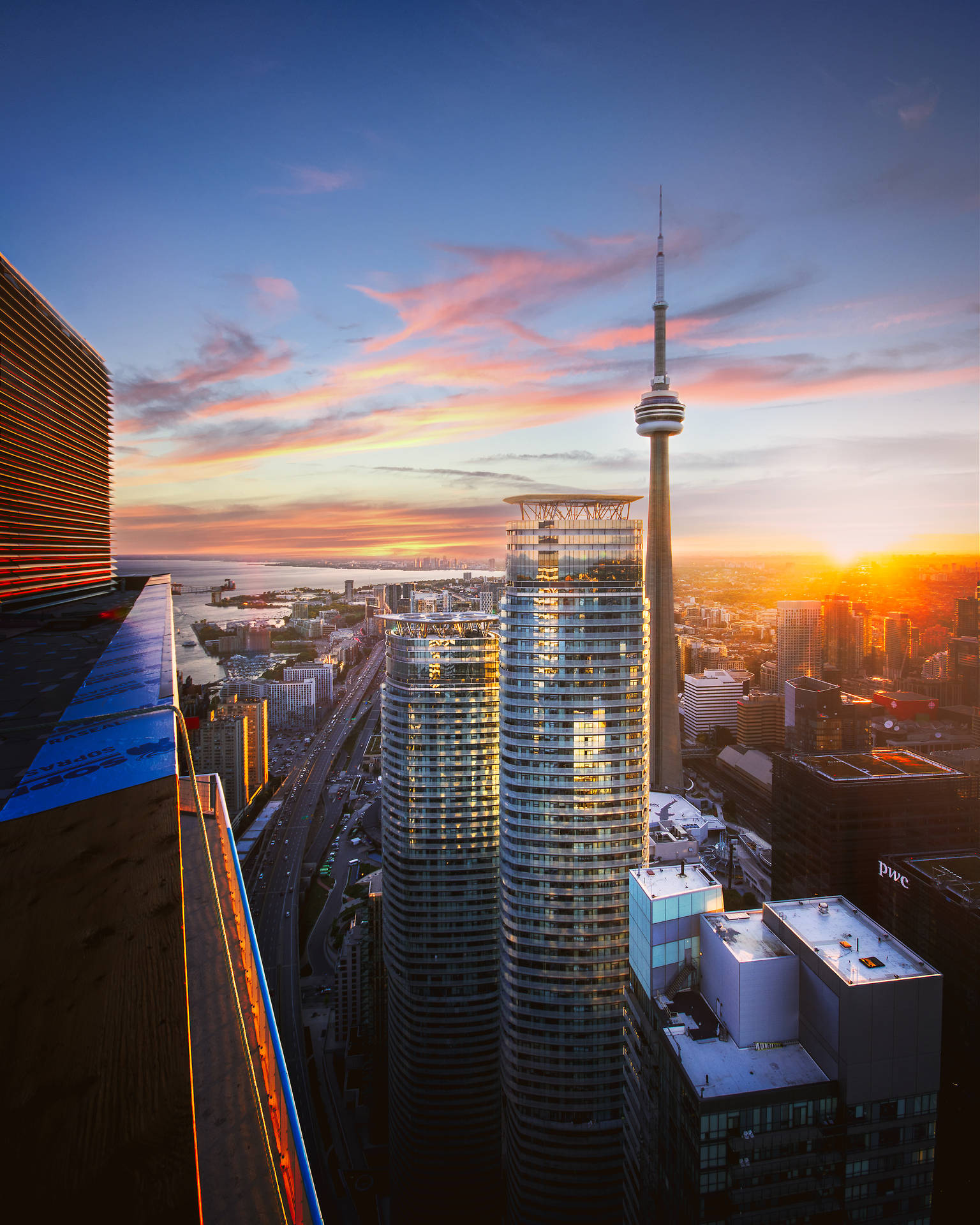 Cn Tower With Toronto Sunset Background