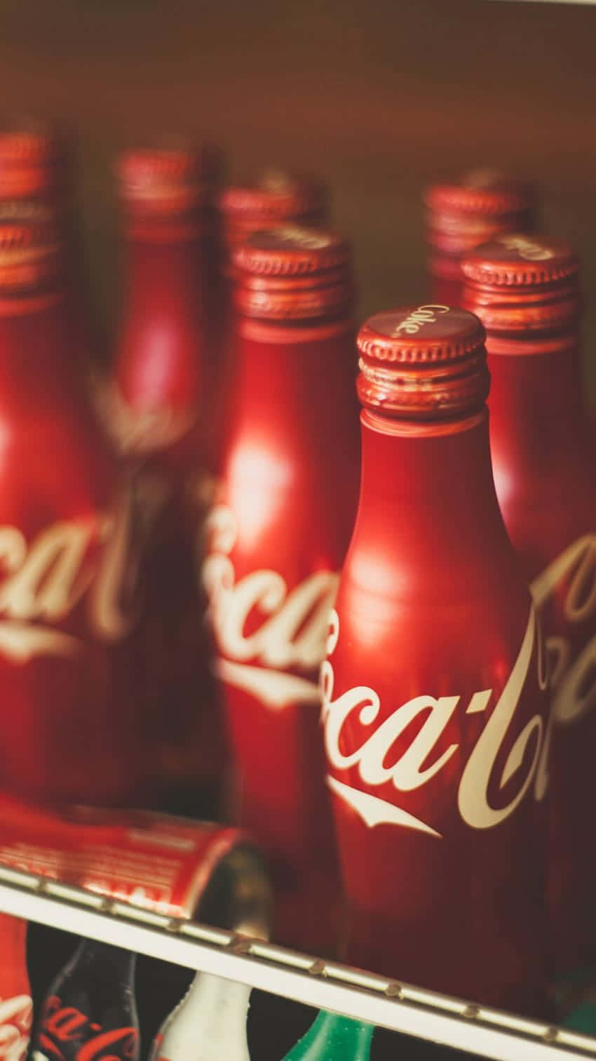 Coca Cola Bottles In A Refrigerator Background