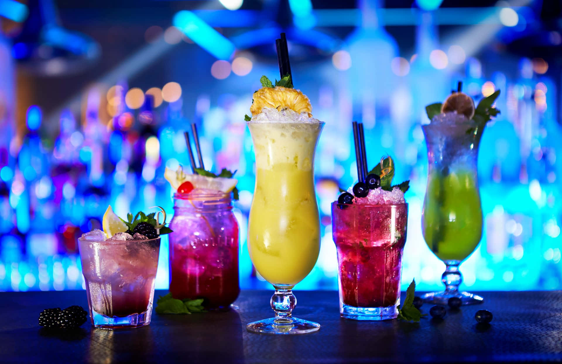 Cocktail Drinks On Blue Light Bar Background