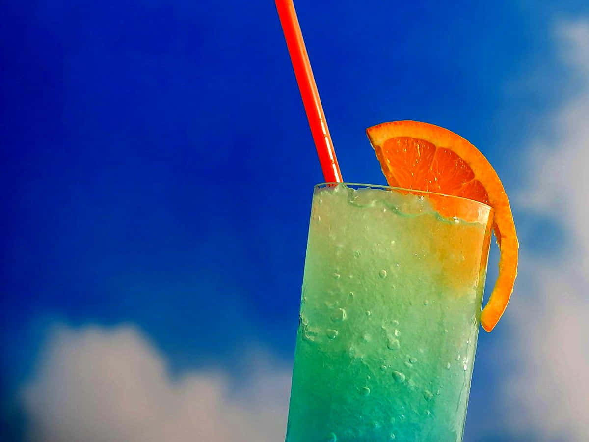 Cocktail Drinks With Orange On Blue Sky