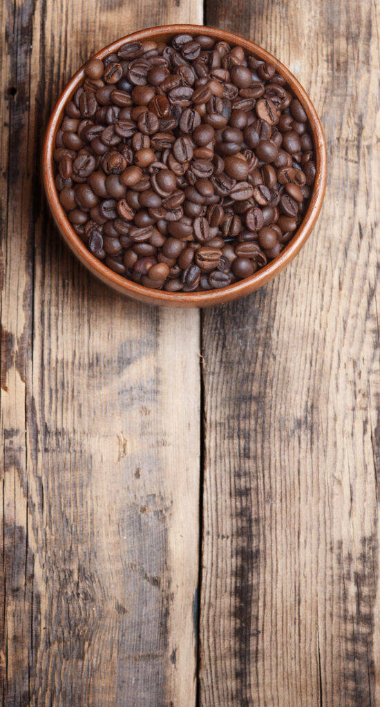 Coffee Beans In Earthenware Bowl Background