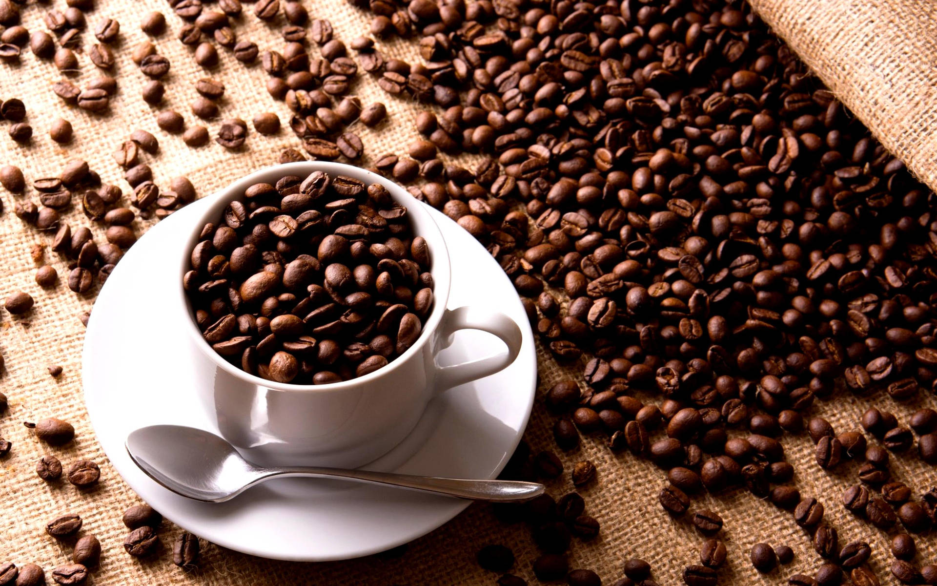 Coffee Cup Filled With Coffee Beans Background