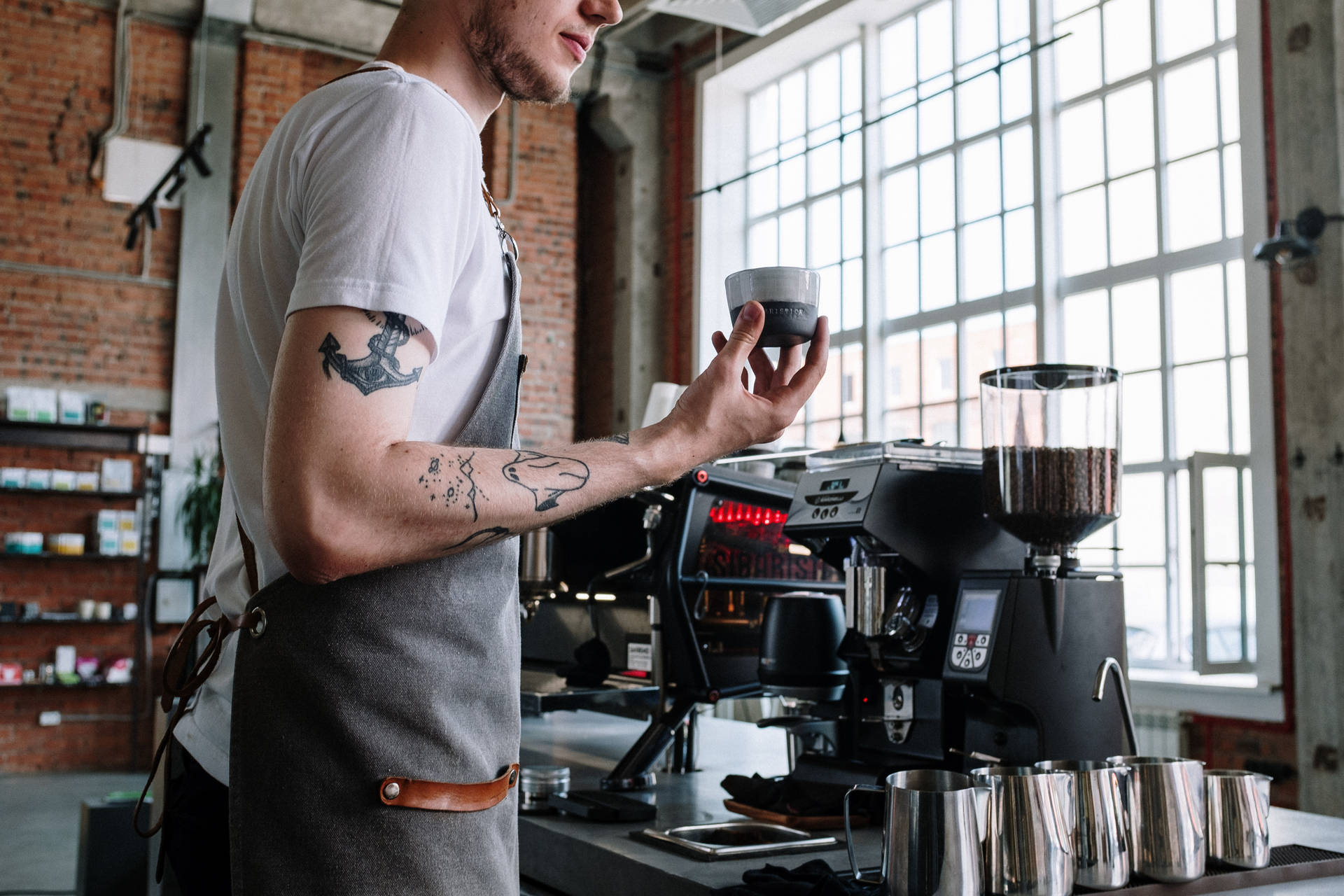 Coffee Shop Employee With Tattoos Background