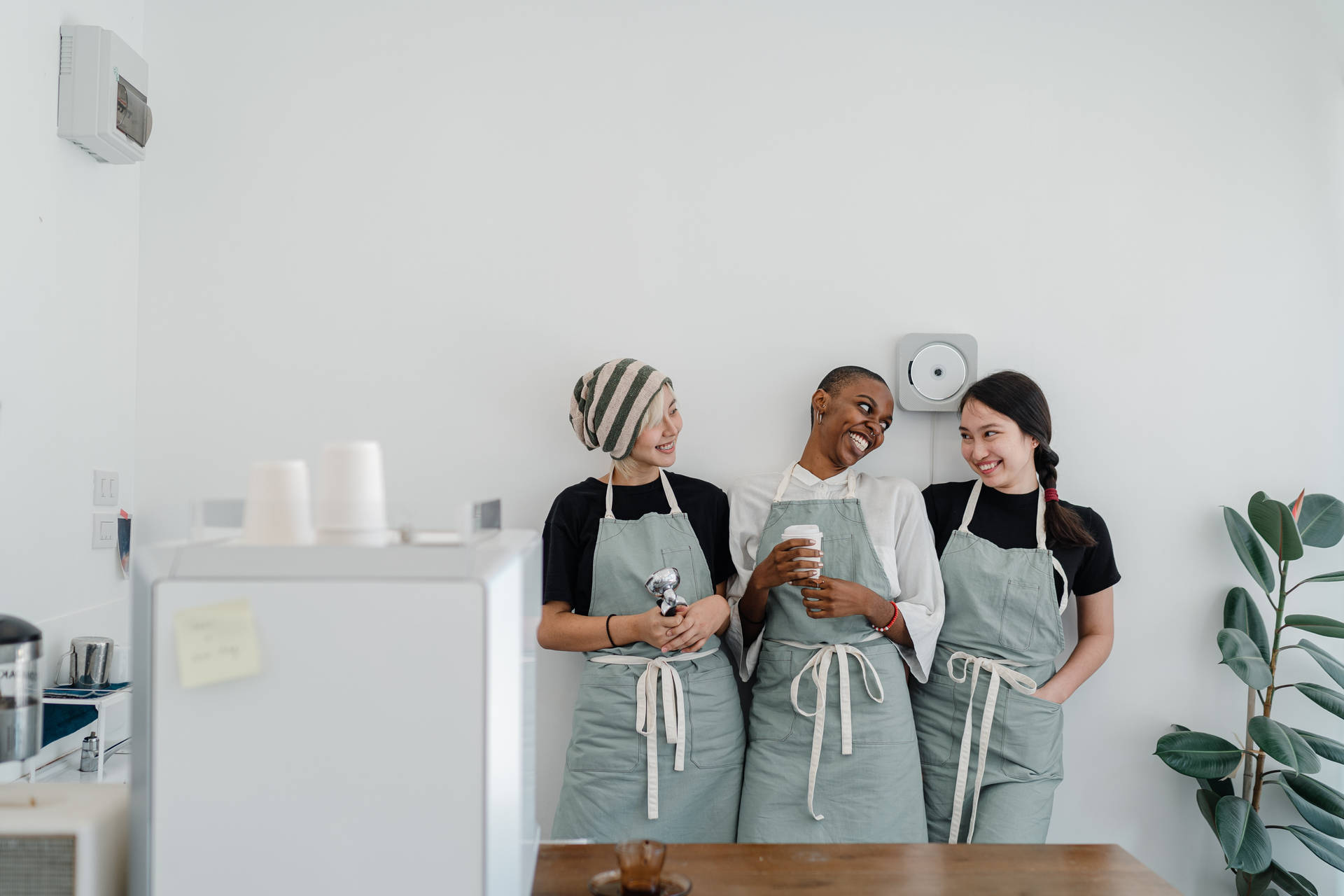 Coffee Shop Employees During Break Background