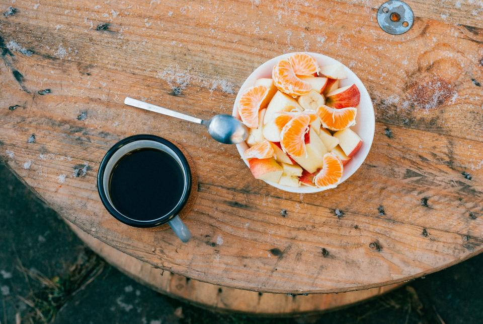 Coffee With Bowl Of Fruits Background