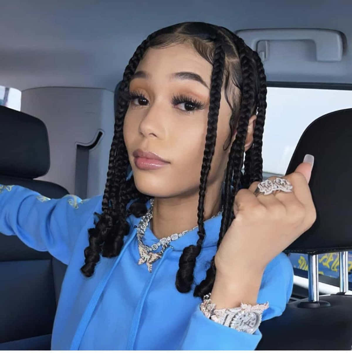Coi Leray Expressing Herself Through Style And Music. Background