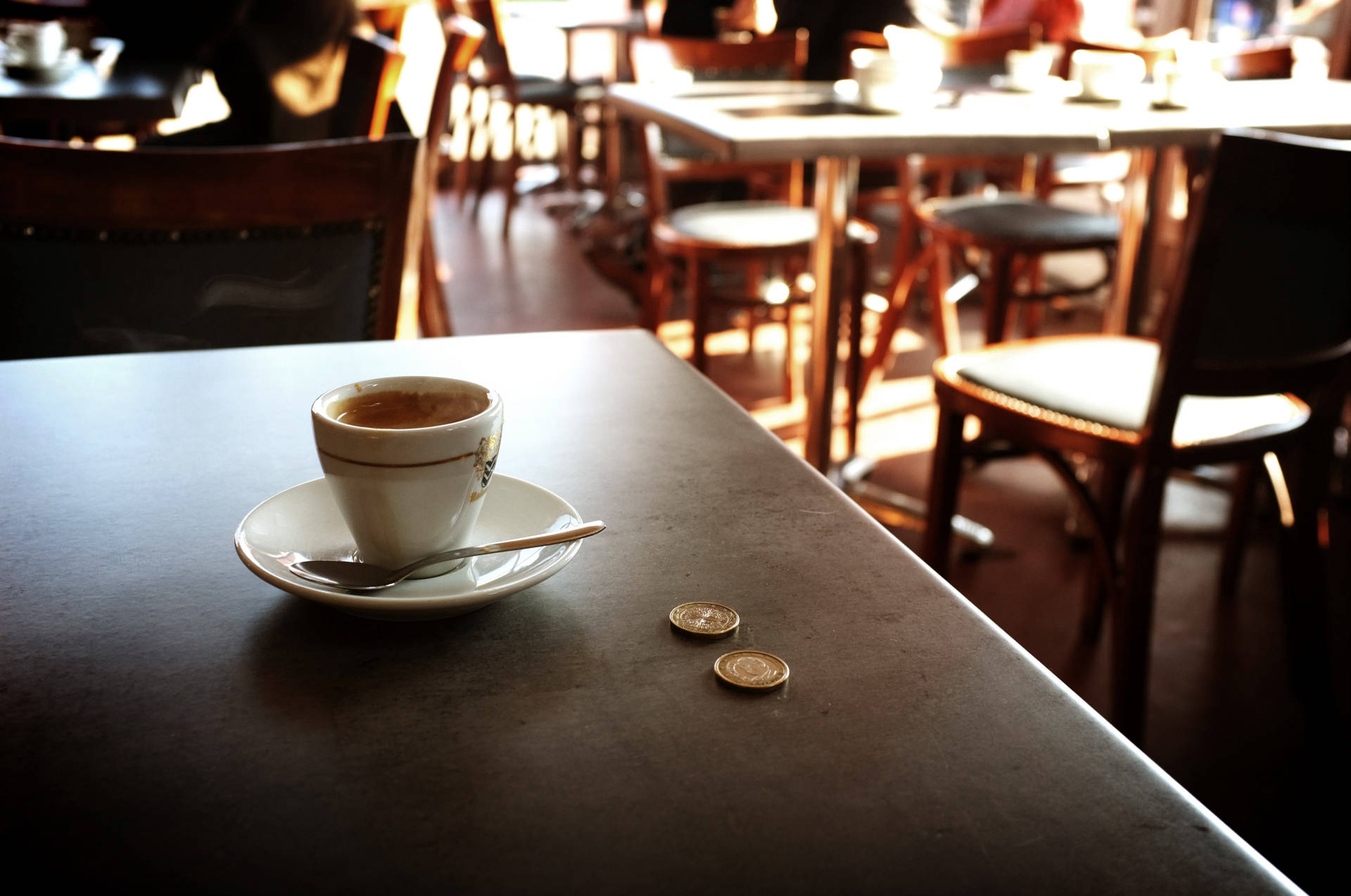 Coins On Coffee Shop Table Background