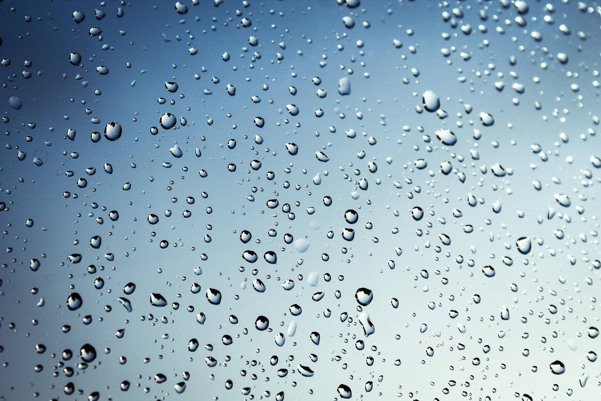 Cold Raindrops On Crystal Glass Surface Background