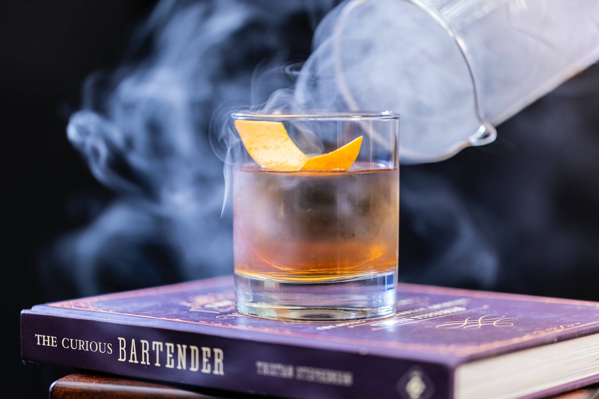 Cold Smokey Whiskey On Book Pile Background