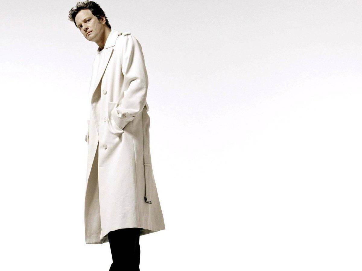 Colin Firth In White Trench Coat For Esquire Magazine Background