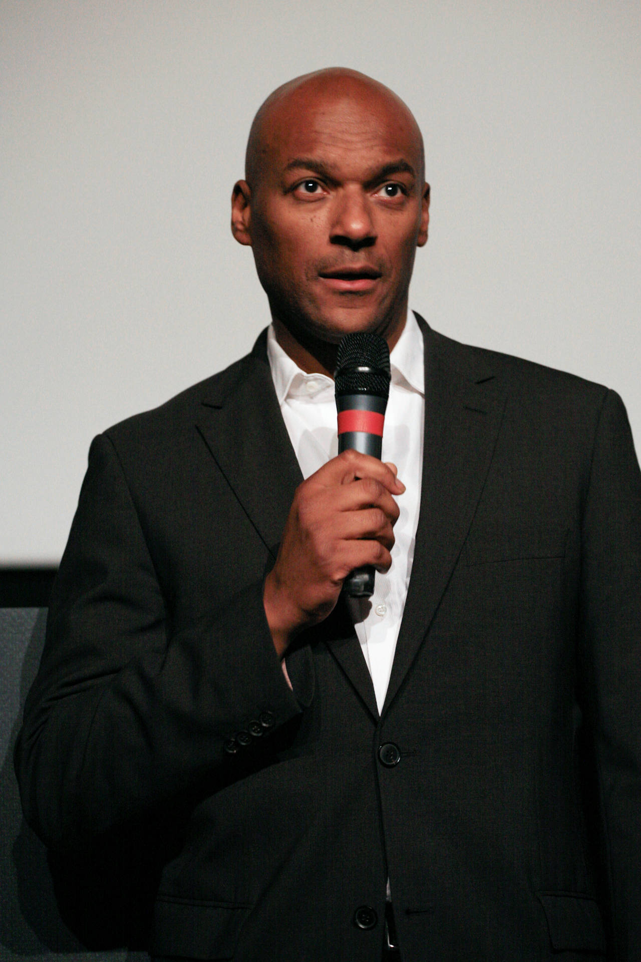 Colin Salmon Holding Microphone