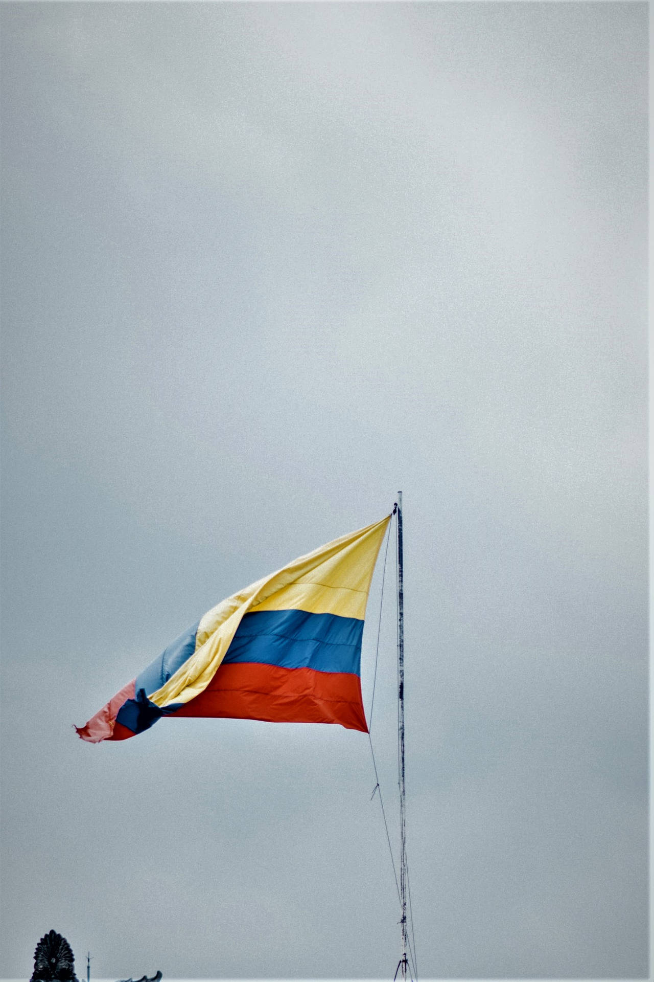Colombia Flag Under The Grey Clouds