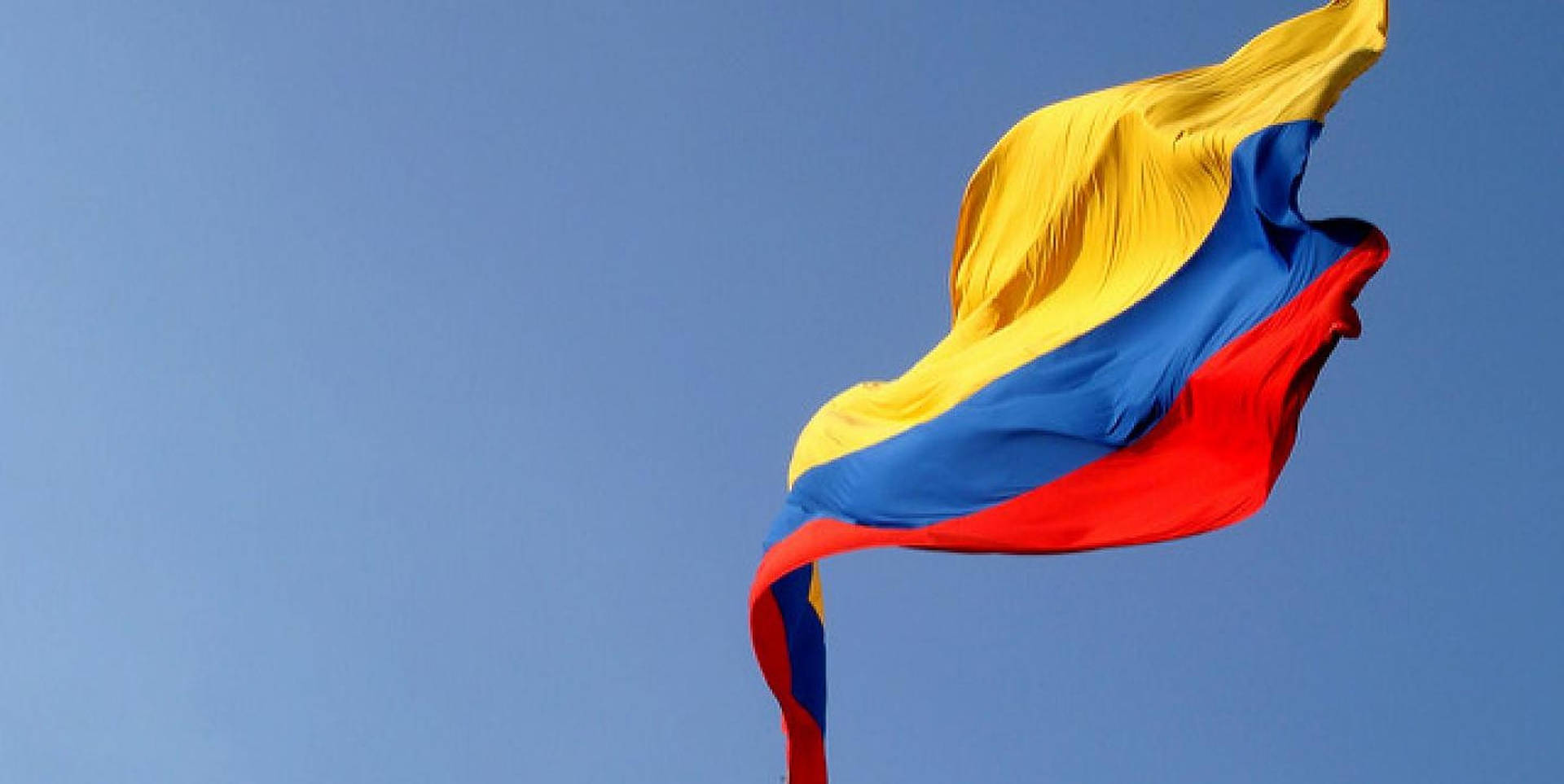 Colombian Flag Blue Sky Background